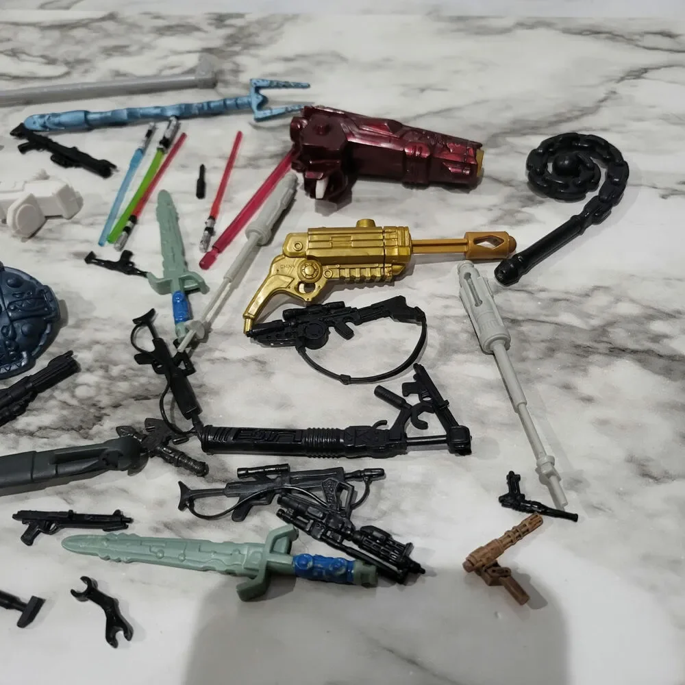 Assorted action figure weapons